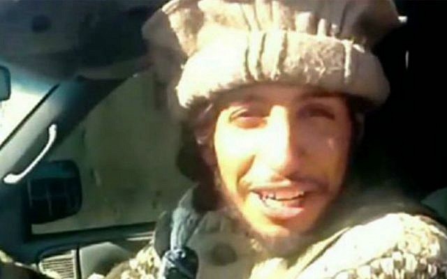 This undated image taken from a jihadist website on Monday Nov. 16, 2015 shows Abdelhamid Abaaoud, the suspected mastermind of the Paris terror attacks on November 13, smiling before dragging mutilated bodies behind his truck in Syria. (Jihadist video via AP)