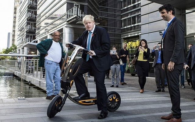 Mayor of London Boris Johnson rides an electric scooter during his visit to Tel Aviv, Israel, November 9, 2015. (AP Photo/Dan Balilty)