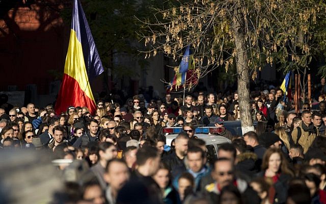 Thousands walk during a mourning march for the victims of the Colectiv nightclub fire in Bucharest, Romania, Sunday, Nov. 1, 2015. (AP Photo/Vadim Ghirda)