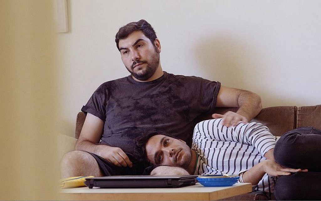 Palestinian Khader Abu-Seif (striped shirt) with his Jewish partner, David, in British director and producer Jake Witzenfeld's 'Oriented,' the story of three Palestinian gay men in Tel Aviv. (courtesy)