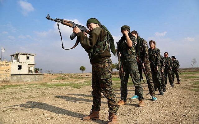 Syriac Christian women, members of the battalion called the "Female Protection Forces of the Land Between the Two Rivers" fighting the Islamic State group, take part in a training on December 1, 2015 at their camp in the town of al-Qahtaniyah, near the Syrian-Turkish border (aka Kabre Hyore in Syriac, and Tirbespi in Kurdish).(AFP PHOTO / DELIL SOULEIMAN / AFP / DELIL SOULEIMAN)