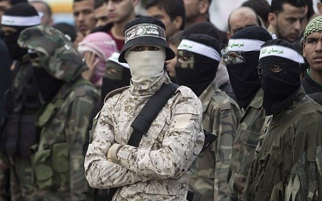 Gunmen from the Izz al-Din al-Qassam Brigades, the armed wing of Hamas, stand guard during a parade marking the ruling Islamist terror movement's 28th birthday on December 11, 2015, in Khan Yunis, in the southern Gaza Strip. (Said Khatib/AFP)