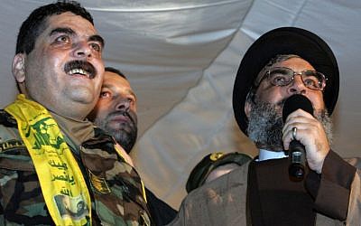 (FILES) - A file picture taken on July 16, 2008, shows Lebanese Hezbollah chief Hassan Nasrallah (R) speaking next to freed Lebanese prisoner Samir Kuntar (L) at a stadium in Beirut's southern suburbs. (AFP PHOTO/MUSSA AL-HUSSEINI / AFP / MUSSA AL-HUSSEINI)