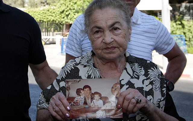 82-year-old Nina Keren, mother of Danny Haran and grandmother of Einat who were killed by Samir Kuntar when he broke into their Nahariya home in 1982 and shot them, holds a picture of her son and her granddaughter on July 15, 2008. ( Kobi Gideon / FLASH90)