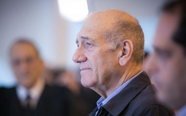 Former prime minister Ehud Olmert speaks to the press at the Jerusalem Supreme Court on December 29, 2015. The court reduced Olmert's sentence to 18 months, following a conviction on corruption charges in the Holyland affair. (Noam Moskowitz/POOL)