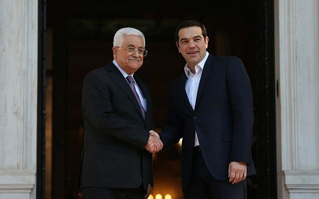Greek Prime Minister Alexis Tsipras, right, shakes hands with President of the Palestinian Authority Mahmoud Abbas before their meeting in Athens, December 21, 2015. (AP/Petros Giannakouris)