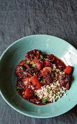 Spiced lamb tagine with currants and Israeli couscous, one of many recipes in 'The Covenant Cookbook' (Courtesy)