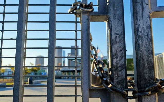 A lock holds the gate shut at Edward Roybal High School in Los Angeles, on Tuesday morning, Dec. 15, 2015. (AP Photo/Richard Vogel)