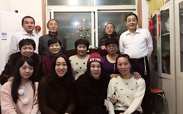 Members of the Kaifeng Chinese Jewish community on the first night of Hanukkah, December 6, 2015. (Shavei Israel)