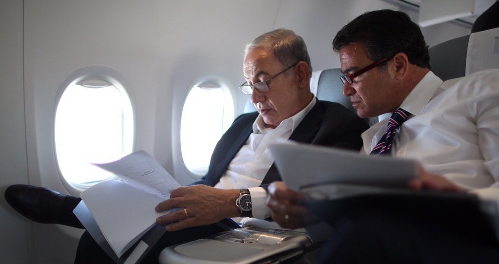 Benjamin Netanyahu and Yossi Cohen look over documents in a photo posted on social media by Netanyahu on December 7, 2015, shortly after he named Cohen as the new Mossad chief. (PMO/Facebook)