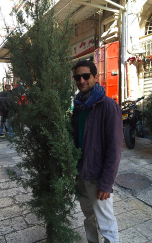 David xx picked out a tree for his grandmother (Jessica Steinberg/Times of Israel)