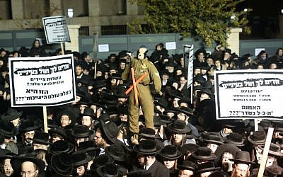 Ultra-Orthodox Jewish men protest against the military draft in Jerusalem's Mea Shearim neighborhood, December 22, 2015. (Yonatan Sindel/Flash90)