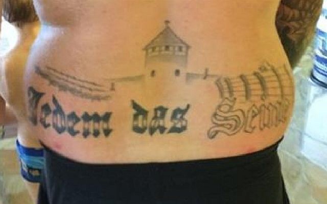 German prosecutors to investigate a man with a tattoo of what appears to be the Auschwitz death camp on his back in a public swimming pool in Oranienburg, eastern Germany on December 1, 2015. (screen capture: YouTube)