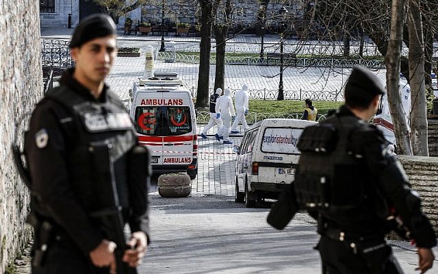 Turkish police stand guard next to ambulances as they block access to the Blue Mosque area after a suicide bombing in Istanbul's tourist hub of Sultanahmet on January 12, 2016, in which 10 German tourists were killed. (AFP/Bulent Kilic)