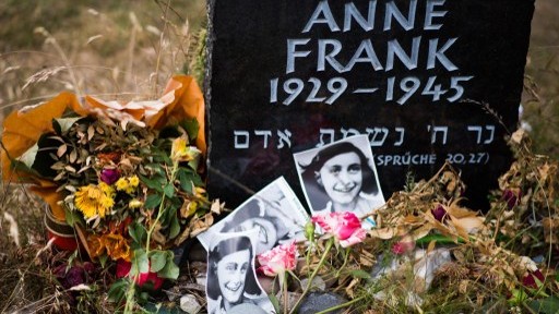 A memorial stone for Anne Frank and her sister Margot on the grounds of the former Prisoner of War (POW) and concentration camps Bergen-Belsen in Bergen, north of Hanover, central Germany, on June 21, 2015. (AFP / NIGEL TREBLIN)