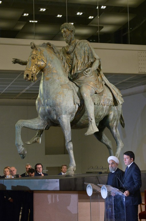 Iranian President Hassan Rouhani (2ndR) and Italian Prime Minister Matteo Renzi (R) hold a press conference at the Capitol Hill in Rome, next to the equestrian statue of Marcus Aurelius, on January 25, 2016. (Tiziana Fabi/AFP)