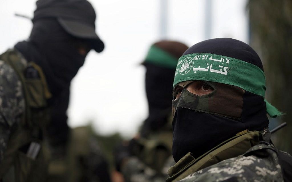 Hamas fighters attend a funeral procession in Gaza City on January 29, 2016, for seven members of the terror group killed when an attack tunnel into Israel collapsed. (AFP/Mohammed Abed)