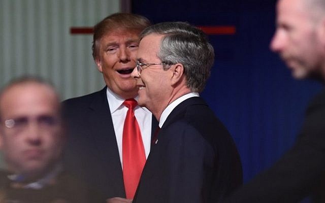 Republican presidential candidates businessman Donald Trump (2nd L) with former Florida Gov. Jeb Bush leaving the Republican presidential debate sponsored by Fox Business and the Republican National Committee at the North Charleston Coliseum and Performing Arts Center in Charleston, South Carolina on January 14, 2016. (Timothy A. Clary/AFP)