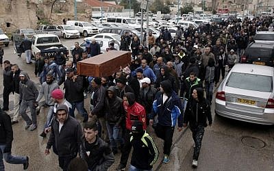 File: Mourners carry the coffin of 42-year-old taxi driver Amin Shaaban during his funeral procession in the city of Lod on January 3, 2016. Shaaban's body was found a short while after a shooting rampage at a central Tel Aviv pub on New Year's Day. (AFP/Ahmad Gharabli)