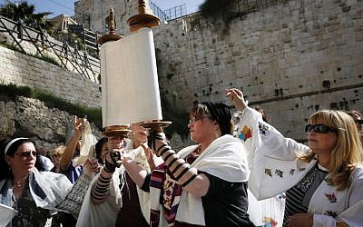 Religious Jewish women which are part of the Women of the Wall organization read from the Torah and pray at Robinson's Arch at the Western Wall in Jerusalem on March 12, 2013. (Miriam Alster/FLASH90)