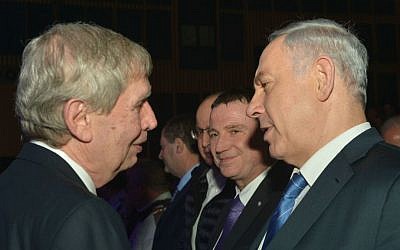 Prime Minister Benjamin Netanyahu, right, with outgoing Mossad chief Tamir Pardo during a farewell ceremony for Pardo in Tel Aviv on January 5, 2015. (Kobi Gideon/GPO)