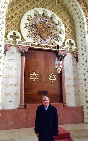 Porto Jewish community spokesman Michael Rothwell poses in front of the ark in the Mekor Haim synagogue in Porto, Portugal, January 28, 2016. (Rachel Delia Benaim/The Times of Israel)