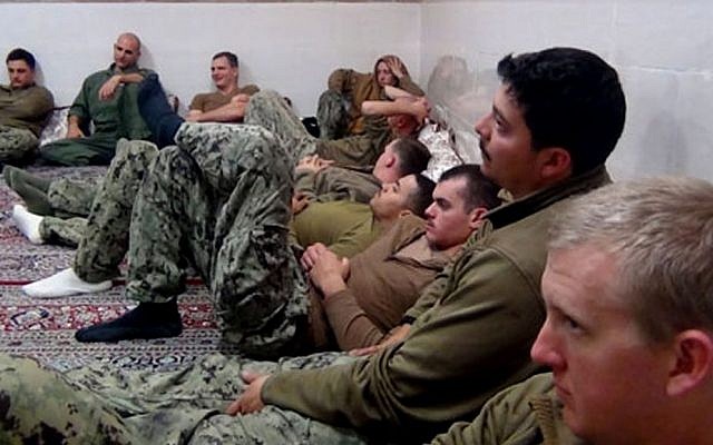This picture released by the Iranian Revolutionary Guards on Wednesday, Jan. 13, 2016, shows detained American Navy sailors, who were subsequently released (Sepahnews via AP)