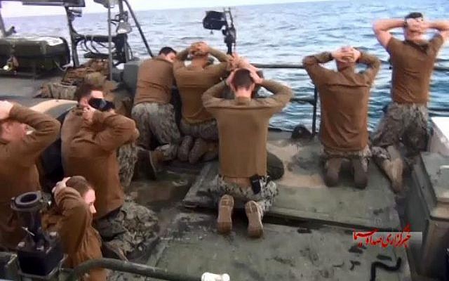 This photo released by the Iranian state-run IRIB News Agency on Wednesday, January 13, 2016, shows detention of American Navy sailors by the Iranian Revolutionary Guards in the Persian Gulf, Iran. (Sepahnews via AP)