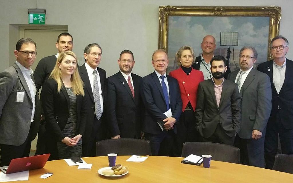 Swedish MPs with representatives of Israel advocacy groups at a January 19, 2016 meeting in Stockholm, including vice chairman of WZO David Breakstone (2nd from right), MP Hanif Bali (3rd from right), MP Mikael Oscarsson (6th from right), and former Israeli MK Dov Lipman (7th from right). (courtesy)