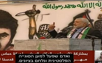Hamas leader Ismail Haniyeh in Gaza praises Israeli terrorist Nashat Milhem, in a news report by Al Quds TV aired by Israel's Channel 10. (Screen capture Channel 10)