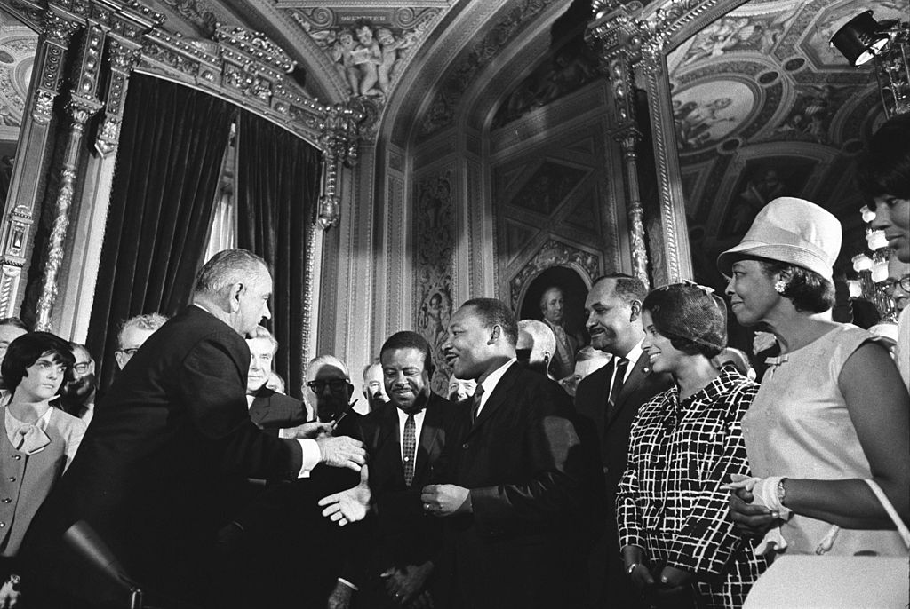 Soon after the passage of the 1965 Voting Rights Act, President Lyndon B. Johnson embraces Dr. Martin Luther King (Wikimedia Commons)