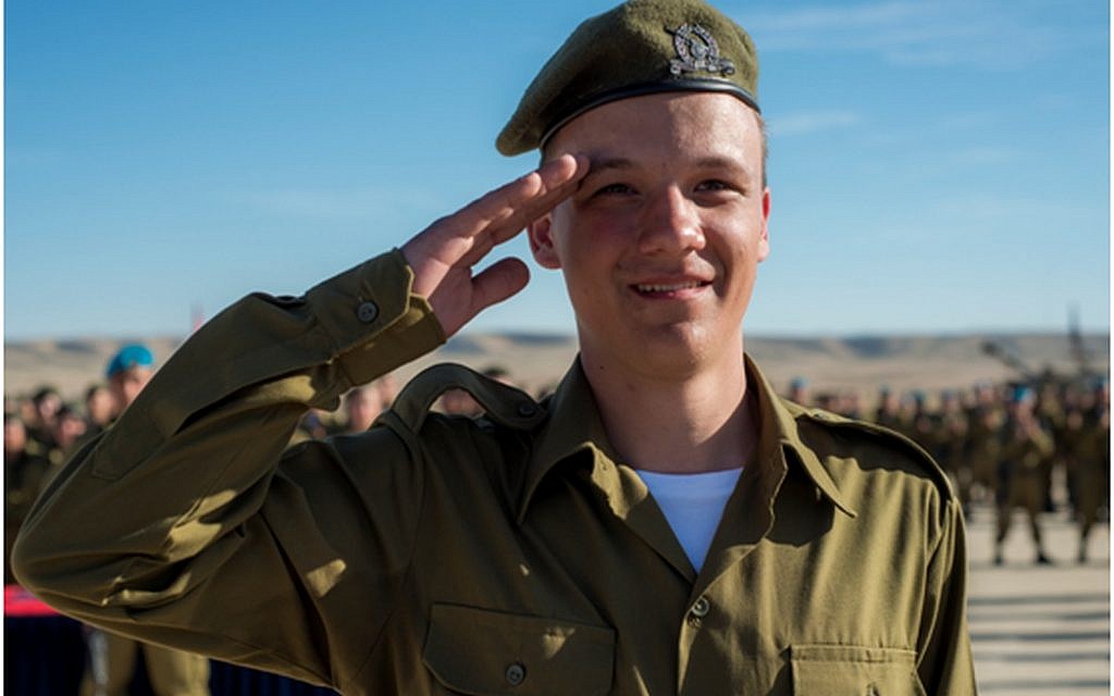 Seth, whose name has been withheld for privacy concerns, salutes after having received an award from his battalion commander for bravery on January 6, 2016. (IDF Spokesperson's Unit)