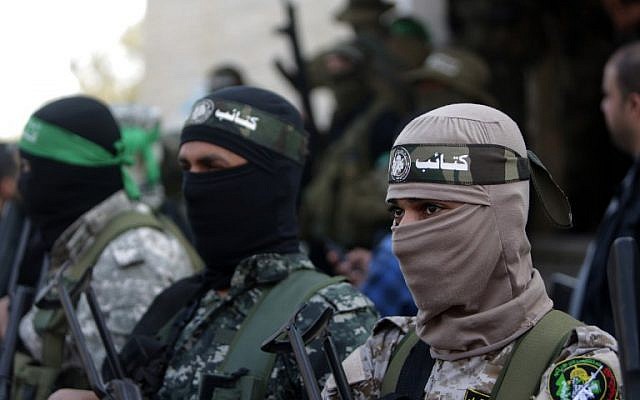 Members of the Izz ad-Din al-Qassam Brigades, the armed wing of the Hamas movement, at the funeral of fellow terrorist Ahmed al-Zahar in the village of Al-Moghraga near the Nuseirat refugee camp in the central Gaza Strip on  February 3, 2016. (AFP/Mahmud Hams)