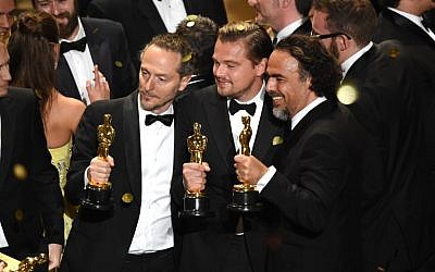Cinematographer Emmanuel Lubezki, actor Leonardo DiCaprio and director Alejandro Gonzalez Inarritu, all winners for 'The Revenant,' pose onstage during the 88th Annual Academy Awards at the Dolby Theatre, February 28, 2016 in Hollywood, California. (Kevin Winter/Getty Images/AFP)