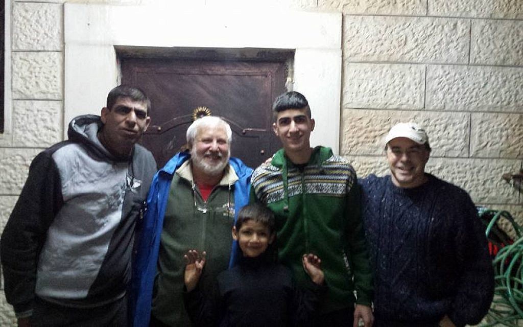 From left to right, Ziad Sabateen, Lonny Baskin, Mustafa Sabateen, Muhammad Sabateen and Phil Saunders pose for a photograph on the night of Muhammad's release after a three-month prison sentence. (Courtesy/Ziad Sabateen)