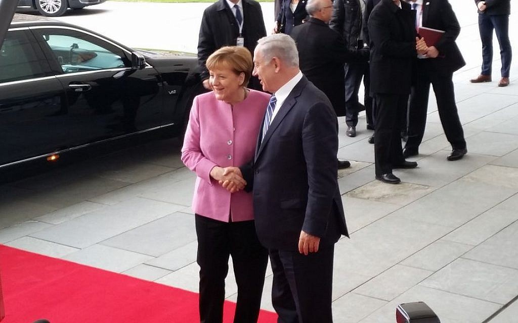 Prime Minister Benjamin Netanyahu, right, being greeted by German Chancellor Angela Merkel on Berlin on February 16, 2016. (Raphael Ahren/Times of Israel)