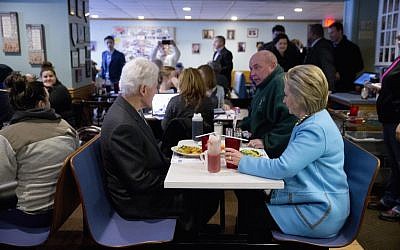 Democratic presidential candidate Hillary Clinton and her husband former President Bill Clinton, have breakfast, Monday, Feb. 8, 2016, at Chez Vachon restaurant in , N.H. (AP Photo/Matt Rourke) 