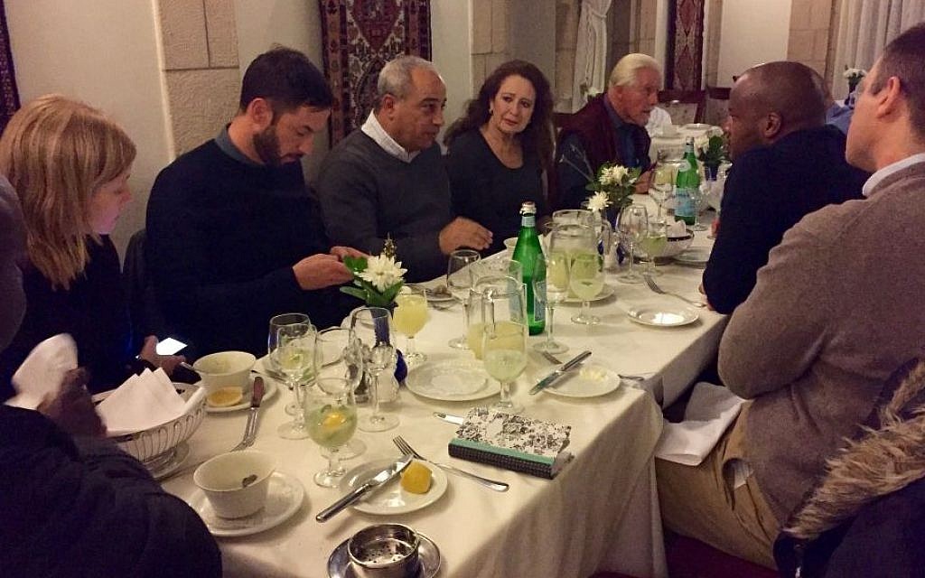 Members of a visiting South African group dine with Mohammad Darawshe (fourth from left) at the American Colony Hotel in Jerusalem, February 2016. (Eliana Rudee)