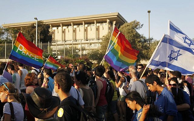Illustrative: Israelis walking past the Knesset during the annual gay parade in Jerusalem, July 29, 2010. (Miriam Alster/FLASH90)