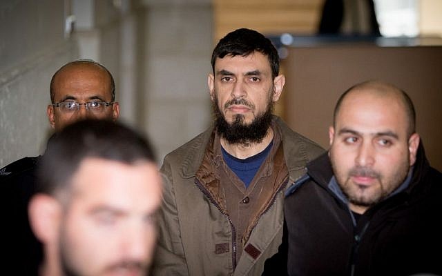 Khaled Koutineh, who ran over and killed Shalom Sherki last April, is brought to the Jerusalem District Court on February 1, 2016. (Yonatan Sindel/Flash90)