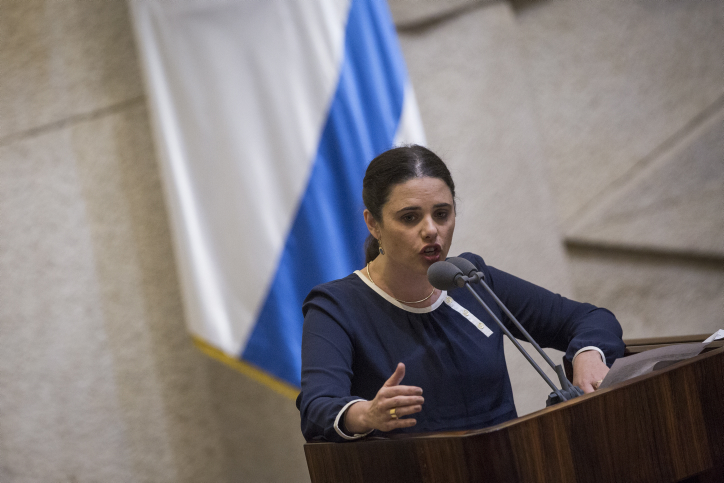 Justice Minister Ayelet Shaked speaks during a plenum session in the assembly hall of the Israeli parliament, before the Knesset votes on the proposed law requiring Left-wing foundations and organizations to reveal their sources of funding, on February 8, 2016. (Hadas Parush/Flash90)