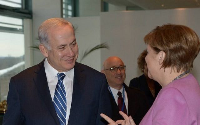 Prime Minister Benjamin Netanyahu meets with German Chancellor Angela Merkel, in Berlin, Germany, on February 16, 2016. (Amos Ben Gershom/GPO)