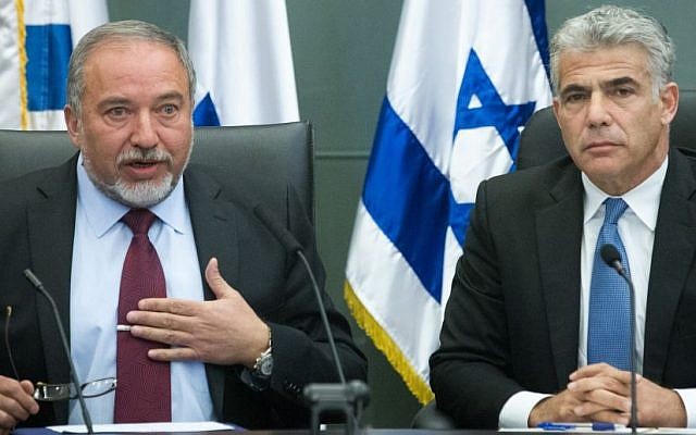 Leader of the Yesh Atid political party, Yair Lapid, and leader of the Yisrael Beytenu party, Avigdor Liberman, lead a joint conference in the Knesset regarding Israel's foreign policy, February 29, 2016. (Miriam Alster/Flash90)