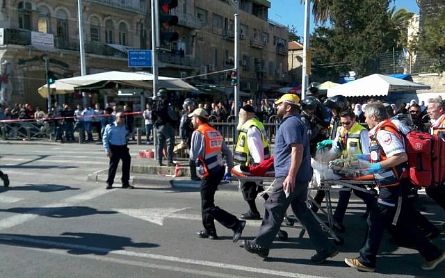 Police and medics at the scene of a shooting attack outside the Damascus Gate of Jerusalem's Old City on Wednesday, February 3, 2016 (Magen David Adom)