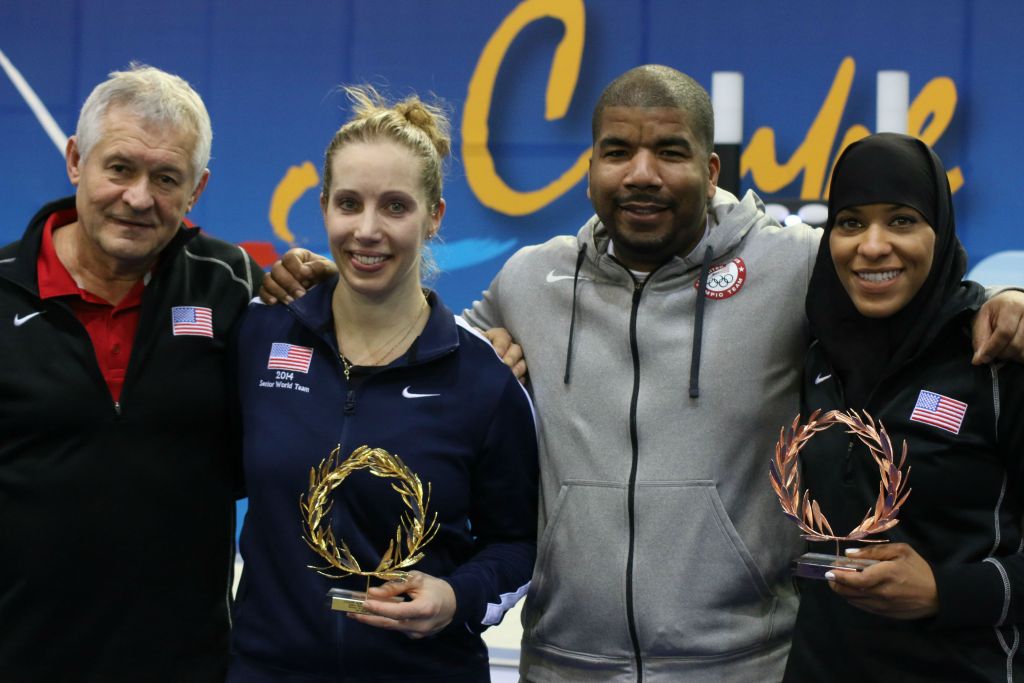 Gold medalist Mariel Zagunis, second from left, and bronze medalist Ibtihaj Muhammad, at right, with coaches Ed Korfanty (left) and Akhi Spencer-El (second from right) at the Athens World Cup, held from January 29-31, 2016. (Jeremy Summers)
