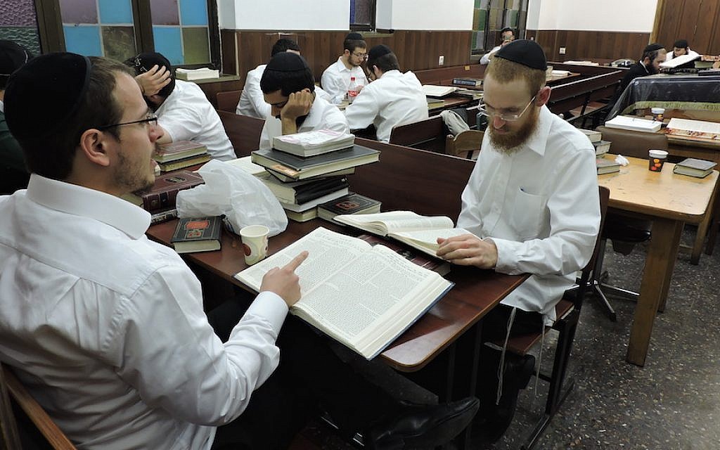 Lubavitcher Hasidim in Kfar Chabad studying Talmud at 770, a brick-for-brick replica in Israel of Chabad headquarters in Brooklyn. (Ben Sales)