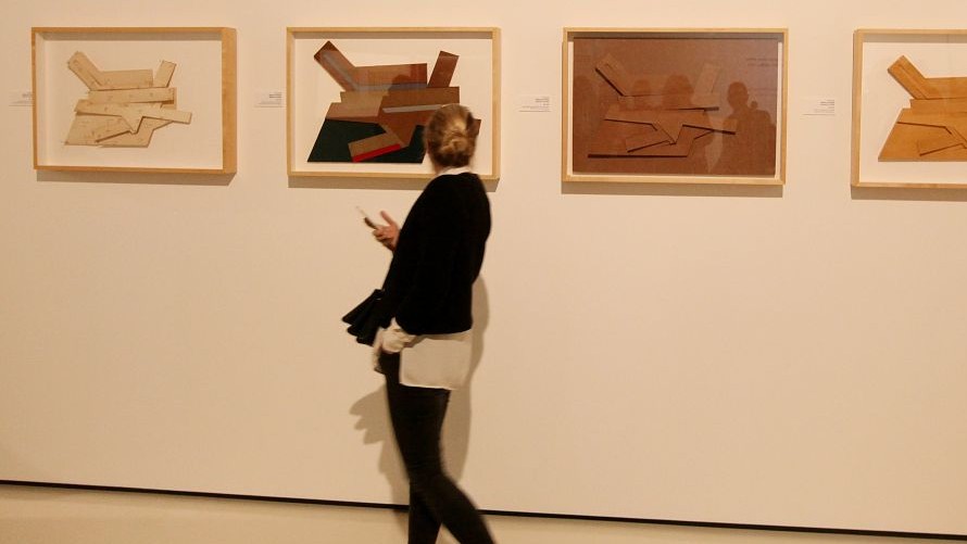 A visitor looks at works on display devoted to Frank Stella at a pre-opening viewing for the press in Warsaw, Poland Thursday, Feb. 18, 2016. (AP Photo/Czarek Sokolowski)