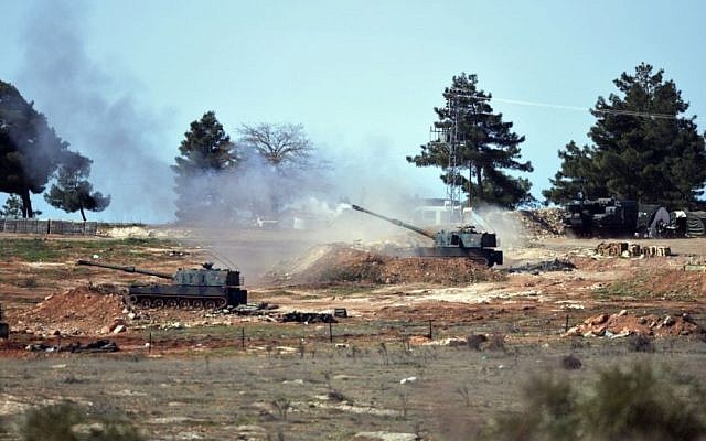 Turkish artillery fire from the border toward northern Syria, in Kilis, Turkey on Feb. 16, 2016. (AP Photo/Halit Onur Sandal)