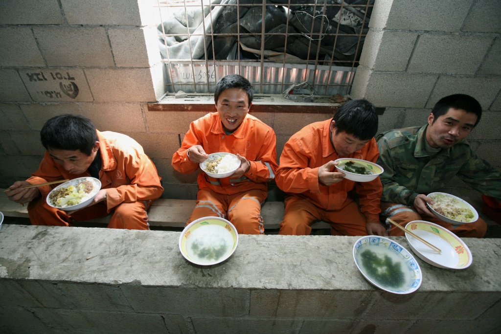 Chinese foreign workers excavating tunnels in the Carmel in northern Israel take a break to have lunch. February 24, 2009. (Photo by Moshe Shai/FLASH90) 