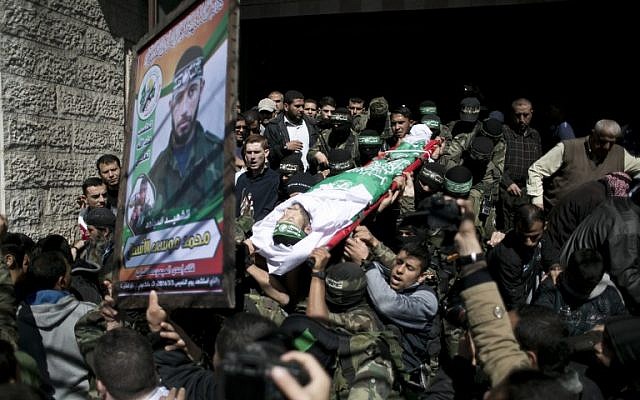 Illustrative: Members of Hamas terror group carry the body of Mohamed al-Astal, killed in a tunnel collapse, during his funeral in Khan Yunis in the southern Gaza Strip on March 4, 2016. (AFP / SAID KHATIB)
